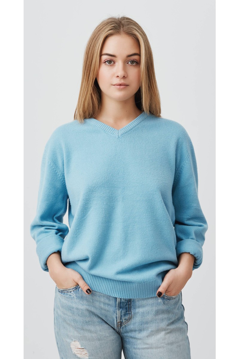 young-tender-fair-haired-teenage-girl-with-healthy-skin-wearing-blue-top-looking-with-serious-pensive-expression-caucasian-woman-model-with-hands-pockets-posing-indoors (1) (2)